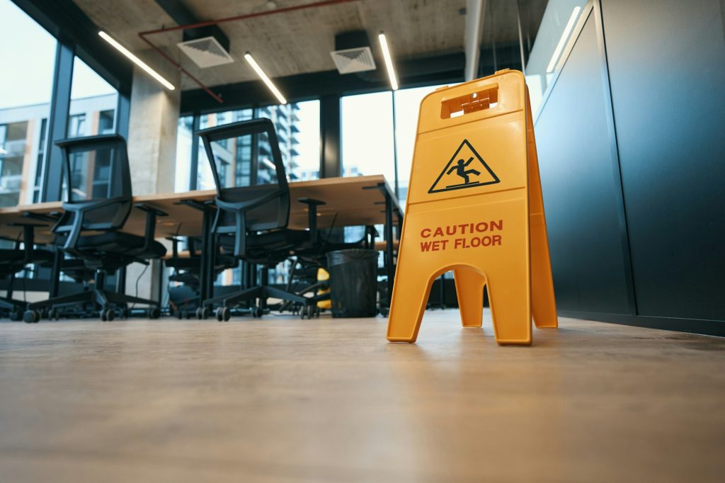 Warning sign caution, wet floor stands on the floor